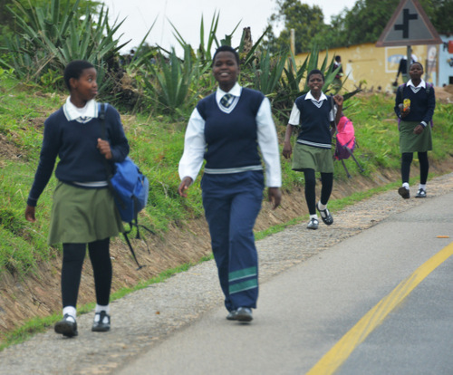 High School aged students walking to school.