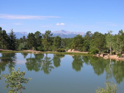 Pikes Peak view over a pond in Fox Run Park.