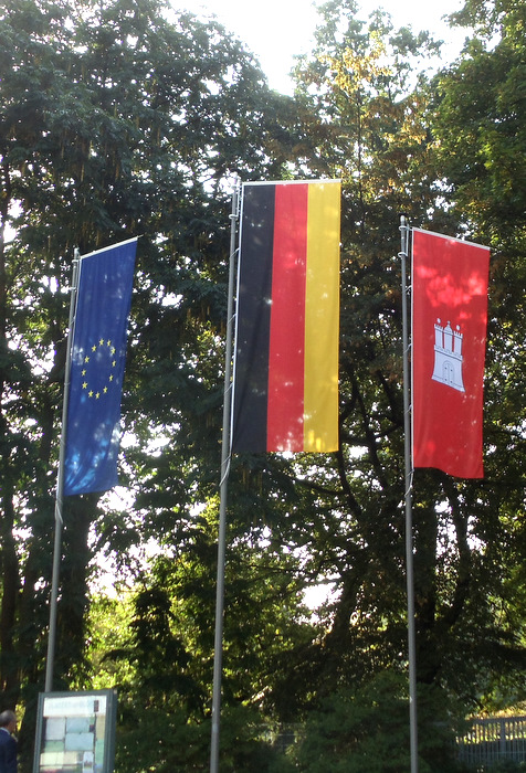 Banners of the EU, Germany and Hamburg.