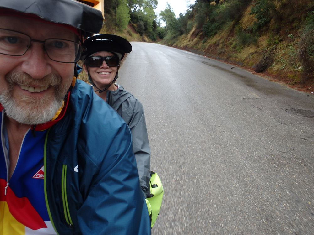 We don't care about wet, we are going to ride today - Dennis and Terry Struck, riding north out of Olympia, Greece.