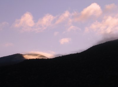 Sunrise through mountain mist.