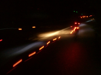 On the road at night.