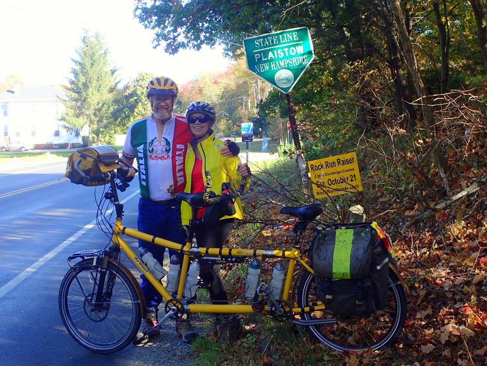 Dennis & Terry Struck and the Bee stand at the Massachusetts-New Hampshire State Line.