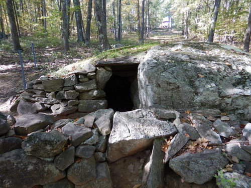 Man made stone laid ground structure.