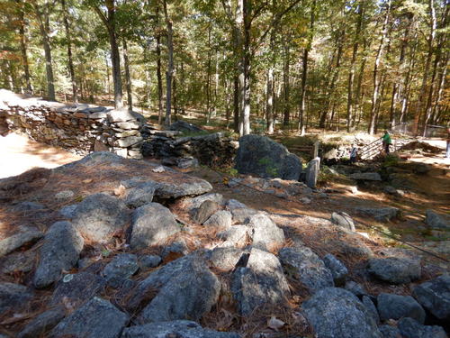 Man made stone laid ground structure.