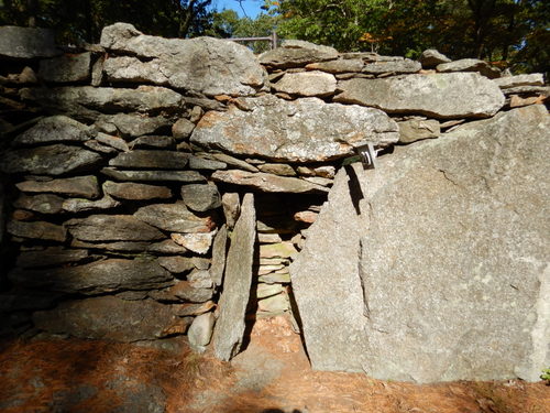 Man made stone laid ground structure.