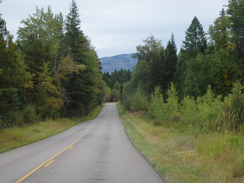 A road heading east that leads toward Columbia Falls, MT.