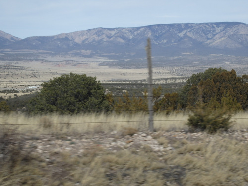 Bicycle motion photo looking down upon a part of the town of Capitan, NM.