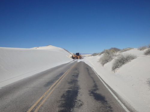 This front-bucket loader was moving sand from the previous days blow.