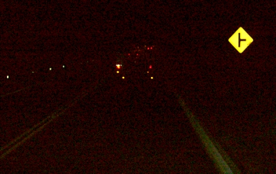 On the road at night.