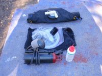 Water Filter System and Rolled Empty Water Bladder.